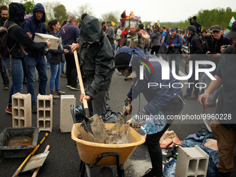 Protesters buid a wall on the N126 during the protest. More than 8000 protesters marched 12km against the planned A69 highway. The collectiv...