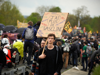 A protester holds a placard reading 'I don't anymore have vaseline'. More than 8000 protesters marched 12km against the planned A69 highway....
