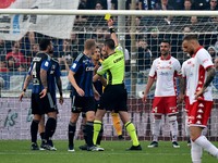 The referee Andrea Colombo shows yellow card to Gaetano Masucci (Pisa) during the Italian soccer Serie B match AC Pisa vs SSC Bari on April...