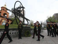 Ukrainian cadets lay flowers at a memorial to firefighters and workers, who died following the Chernobyl Nuclear Power Plant disaster, durin...