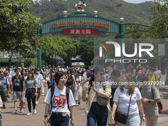 People walking at the entrance of the Hong Kong Disneyland on April 28, 2023 in Hong Kong, China. (