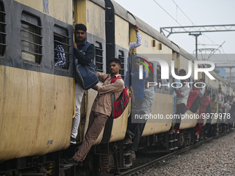 People travel in an overcrowded train at a railway station in Ghaziabad, Uttar Pradesh, on the outskirts of New Delhi, India on April 28, 20...