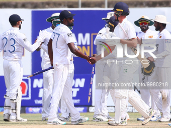 Sri Lankan teammates celebrate after winning the test series on the final day of the second Test match between Sri Lanka and Ireland at the...