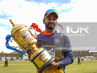 Dimuth Karunaratne of Sri Lanka poses with Wining trophy after winning the test series on the final day of the second Test match between Sri...