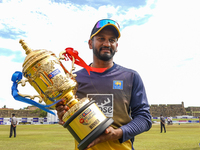 Dimuth Karunaratne of Sri Lanka poses with Wining trophy after winning the test series on the final day of the second Test match between Sri...