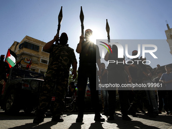 Palestinian militants from the Popular Front for the Liberation of Palestine (PFLP) stage a parade in Khan Yunis in the southern Gaza Strip...
