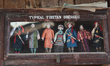Handmade dolls showcasing traditional Tibetan attire on display at the Tibetan Refugee Cen...