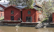 Red-ochre painted warehouses along the Porvoonjoki River in Porvoo, Finland on Monday, May...