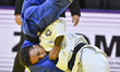 Amandine Buchard (white) of France in action against Reka Pupp (blue) of South Korea durin...