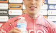 The pink jersey remains with Norwegian Leknessund as he is interviewed at the finish line...