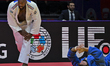 Teddy Riner (white) of France and Inal Tasoev of Russia compete during the men's +100kg go...