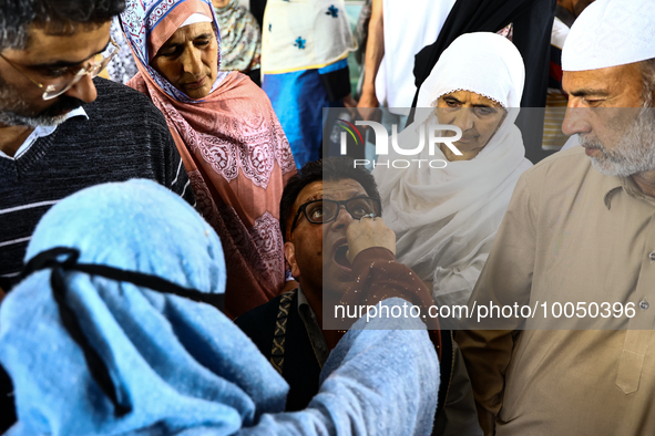 Kashmiri Muslims receive drops before leaving for Hajj during Hajj Vaccination program at SDH Sopore District Baramulla Jammu and Kashmir In...