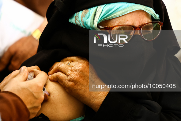 A woman recieves a dose of Vaccine during Hajj pilgrimage vaccination program in Sopore District Baramulla Jammu and Kashmir India on 16 May...