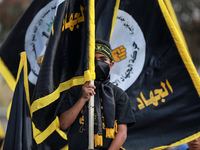 Supporters of the Islamic Jihad take part in a rally in Gaza to commemorate armed commanders and operatives killed by Israel in the past fiv...