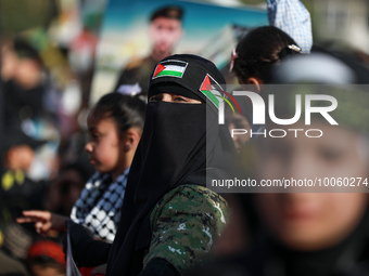A person looks on as the Palestinian Islamic Jihad group holds a rally in Gaza to commemorate armed commanders and operatives killed by Isra...