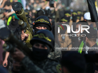 Fighters with the Islamic Jihad take part in a rally in Gaza to commemorate armed commanders and operatives killed by Israel in the past fiv...