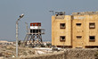 Egyptian soldiers stand guard in the Egyptian city of Rafah, near the border with southern...