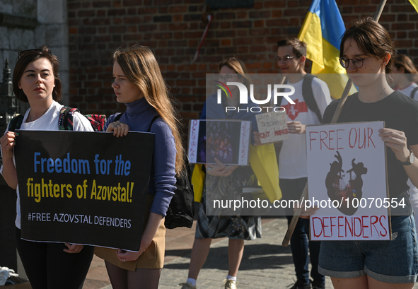 KRAKOW, POLAND - MAY 21, 2023:Members of the local Ukrainian diaspora gather at the main Market Square in Krakow to commemorate the defende... by Artur Widak/NurPhoto
