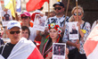 Protesters hold banners and flags during a demonstration of support and solidarity with Be...