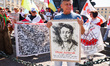 Protesters hold banners and flags during a demonstration of support and solidarity with Be...