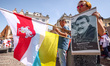 Protesters hold banners and flags during a demonstration of support and solidarity with Be...