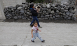 Inhabitants of San Nicolas de Los Ranchos and Xalitzintla, Puebla, walk on ash-covered str...