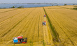 KUNSHAN, CHINA - MAY 23, 2023 - Farmers drive combine harvesters to harvest ripe wheat at...