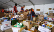 Volunteers at work at the Emergency hub to manage the collection and distribution of essen...