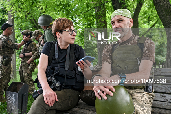 ZAPORIZHZHIA REGION, UKRAINE - MAY 28, 2023 - A journalist interviews a serviceman of the 128th Mountain Assault Brigade before the 30th Che...