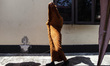 Buddhist monks take a rest during their religious journey in Pringsurat, Central Java, on...