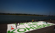 

General views of several climate activists painting a huge message of ''1.5 Degree Goal...