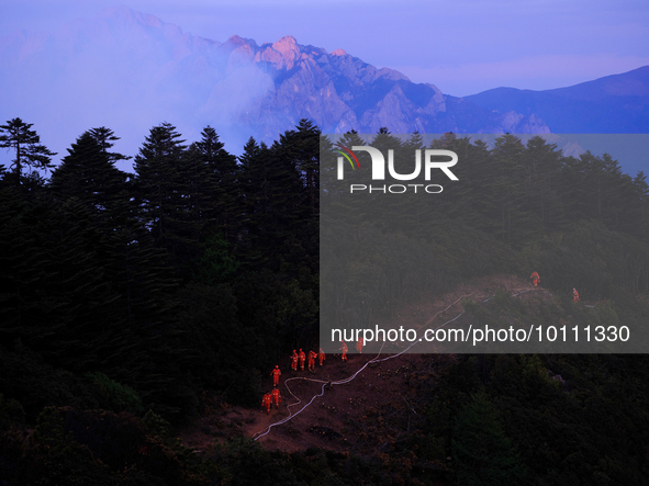 MULI, CHINA - MAY 30, 2023 - Firefighters on the road at Muli Fire site in Muli County, Liangshan, Sichuan province, China, May 30, 2023. At...