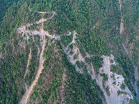 MULI, CHINA - MAY 30, 2023 - Firefighters survey the mountain road of Muli fire site in Muli County, Liangshan, Sichuan province, China, May...