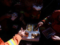 MULI, CHINA - JUNE 1, 2023 - Firefighters of a squadron of Chengdu Forest Fire Brigade eat and replenish supplies during a break in fighting...