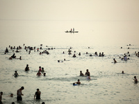 Palestinians enjoy the beach of the Mediterranean Sea on the coast of Gaza City, on June 2, 2023, during a heat wave. (