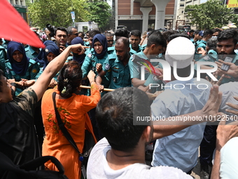 Police scuffle with disabled people as they protest demanding to raise their government allowance, in Dhaka, Bangladesh, on June 4, 2023 (