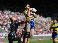 Warrington Wolves' Connor Wrench catches a high ball before going over for a try during the BetFred Super League match between Hull Football...