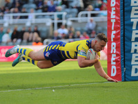 Warrington Wolves' George Williams goes over for a try during the BetFred Super League match between Hull Football Club and Warrington Wolve...