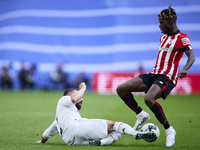 Daniel Carvajal of Real Madrid Cf (L) battles for the ball with Nico Williams of Athletic Club  during a match between Real Madrid v Athleti...