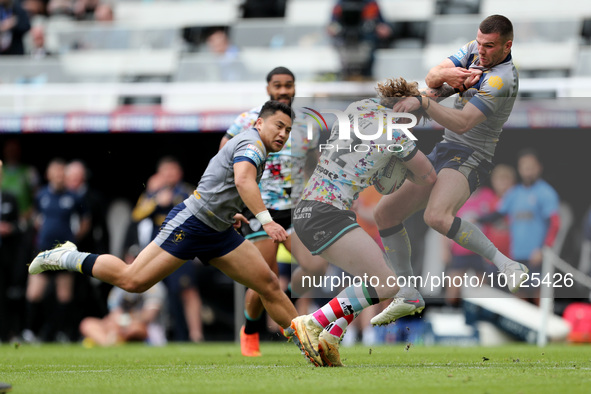 Tom Nisbet of Leigh Leopards in action with Wakefield Trinity's  Max Jowitt during the BetFred Super League match between Hull Football Club...