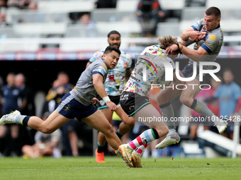 Tom Nisbet of Leigh Leopards in action with Wakefield Trinity's  Max Jowitt during the BetFred Super League match between Hull Football Club...
