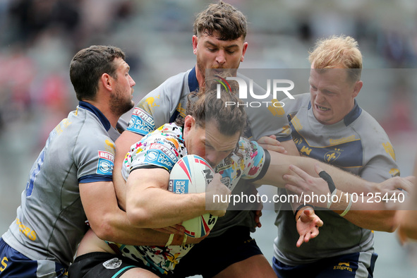Robbie Mulhern of Leigh Leopards is tackled during the BetFred Super League match between Hull Football Club and Warrington Wolves at St. Ja...