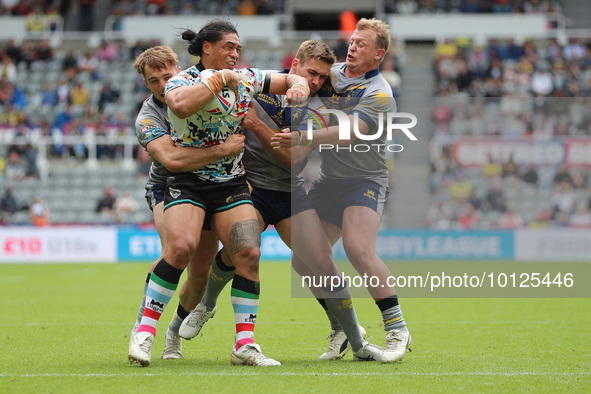 Tom Amone of Leigh Leopards is tackled during the BetFred Super League match between Hull Football Club and Warrington Wolves at St. James's...