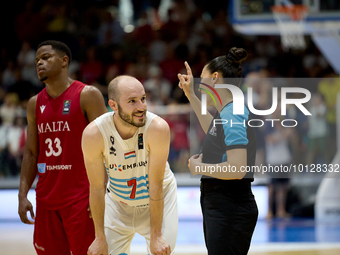 
TA' QALI, MALTA:
Luxembourg national basketball team player Philippe Gutenkauf (L) shares a light moment with one of the match officials du...
