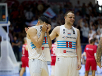 
TA' QALI, MALTA:
Luxembourg national basketball team players Malcolm Kreps (L) and Oliver Vujakovic (R) celebrate winning the Gold Medal af...