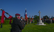 CHOUIN, FRANCE - JUNE 07, 2023:   British bagpiper and French flag-bearers honor fallen s...