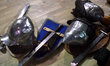 Fighting helmets, swords and shields are laid on the floor during World Medieval Fighting...