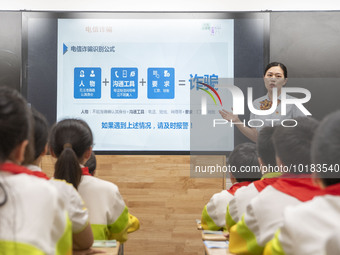 A staff member of China Construction Bank publicized fraud prevention knowledge to students on June 19, 2023 in Nantong, Jiangsu Province, C...