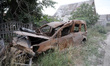 DONETSK REGION, UKRAINE - JUNE 16, 2023 - A burned-down car destroyed as a result of shell...