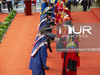 A general view of the 2023 graduation ceremony of China University of Petroleum in Qingdao, Shandong Province, China, June 20, 2023. Thousan...